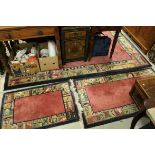 Three Nepalese Wool Rugs, each with a pink / purple ground and border of stylised flowers and