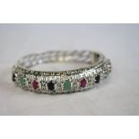 Silver bangle set with emerald, sapphire and ruby panels
