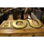 Three Large Gold Coloured Letters, ' O ' and ' U ' 34cms high and ' A ' 24cms high