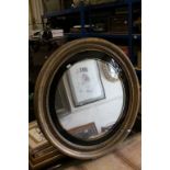 19th century Circular Gilt Framed Mirror decorated with a band of balls and with a black glass slip,