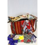 Carpet bag of mixed fabrics etc to include Scarves, tea towels, Handbags etc