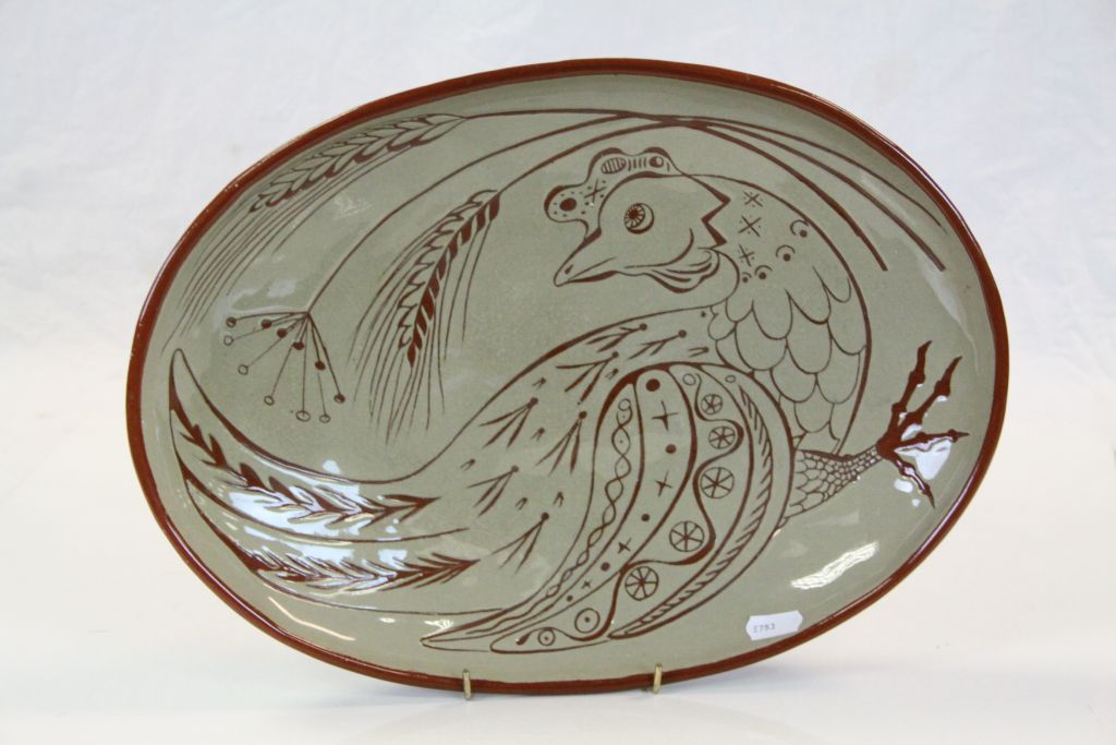 Part glazed oval Teracotta Studio Pottery dish with Stylized Chicken design and marked "W.S DEC