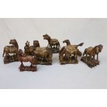 Approximately 14 carved oriental Wooden Horses, with Glass eyes