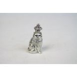 Unusual silver figure of a cat with ruby set crown and emerald eyes