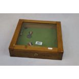 Counter top Display cabinet with two Commemorative Medals, a Whistle & a Button