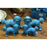 Two Pairs of Chinese Turquoise Blue Glazed Ceramic Standing Dogs of Foe, 14cms high and 11cms high