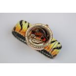 Unusual watch with tiger style strap
