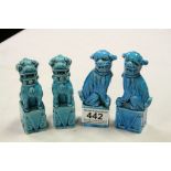 Two Pairs of Small Chinese Turquoise Blue Glazed Seated Dogs of Foe, 12cms high and 11cms high