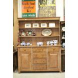 Arts and Crafts Style Oak Dresser, the panelled back with two shelves above a central bank of four