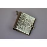 Silver locket in the form of a book
