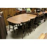 Ercol Elm Extending Dining Table with Pull Up Additional Leaf raised on four central supports,