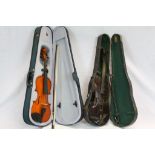 Three cased violins to include violin decorated with a carved lion mask to neck together with bow,