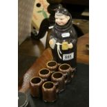 A novelty Friar spirit flask together with six mugs