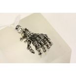 Silver skeleton hand in the form of a pendant