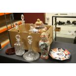 Five cut glass decanters, two lidded vases and an Imari octagonal plate