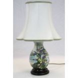 Moorcroft pottery Lamp with "Thistle & Seaside" decoration, stands approx 19cm excluding wooden base