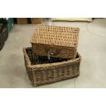 A small vintage wicker picnic basket and a similar basket