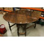 18th century Oak Oval Gate-leg Table with drawers to both ends, raised on turned and block supports,