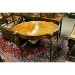 French Louis XV Style Marquetry Inlaid Walnut Centre Table, the shaped top with gilt metal mounted