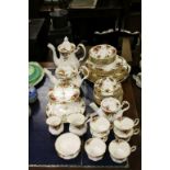 Royal Albert Country Roses dinner service to include plates, bowls, teapot, coffee pot, cake stand