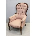 Victorian Mahogany Framed Button Back Armchair with Carved Scroll Arms and Legs raised on castors