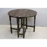Small 18th century Oak Oval Gate-leg Table raised on turned baluster and block supports, 68cms