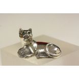 Silver cat shaped pincushion with emerald eyes