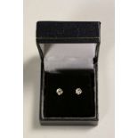 Pair of 14CT White Gold Diamond stud earrings of 90 points approx.