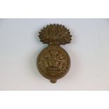 A Royal Welsh Fusiliers All Brass Grenade Cap Badge With Rear Slider.