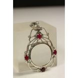 Silver magnifying glass with Ruby Cabochon decoration