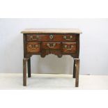 George II Walnut Lowboy, the top with moulded edge, one long drawer above three short drawers and