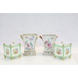 A pair of 19th century continental ceramic trumpet shaped vases with floral decoration and a pair of