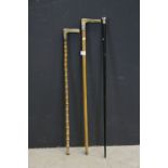 Silver topped antique walking cane and two silver mounted antler handled walking sticks