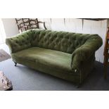 Victorian Green Upholstered Button Back Chesterfield Sofa raised on bun feet and castors, 192cms