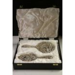 Boxed Hallmarked Silver Hand Mirror & Brush set, two piece with heavily embossed decoration
