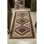 Eastern Red and Cream Geometric Patterned Wool Rug with Floral Motif Border, 184cms x 102cms