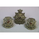 A Queen Victoria Crown The Border Regiment Other Ranks Cap Badge And Pair Of Collar Badges. White