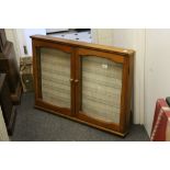 Pine two door hanging collectables cabinet with glass shelves