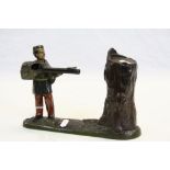 19th Century painted Cast Iron Money bank modelled as a Soldier firing into a Tree trunk and