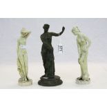 A bronze/brass figure of a classical woman and two other figures of bathing maidens