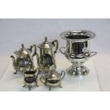 A four piece silverplated tea set and a silmilar bottle stand.