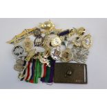 A Collection Of Militaria To Include Military Badges And Buttons, Medal Ribbons And Belt Buckle,