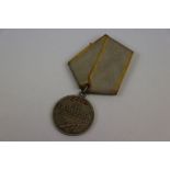 A Russian Soviet Full Size Medal For Combat Service, Established 17/10/38. No.1000157.