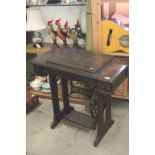 Early 20th century Oak Singer Sewing Machine Treadle Table with Partial Iron Base, 86cms wide x
