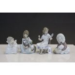 Four vintage Lladro ceramic Figurines to include Inuit child with Polar Bear, Girl with Cats, winged