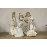 Four Lladro ceramic Figurines to include; Girl with Lamb, Girl with Kitten, Girl in Garden with Bird