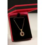 14CT Yellow Gold Ruby and Diamond cluster pendant necklace