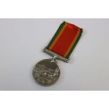 A Full Size Africa Service Medal Named To 12066 0 E.J. JONES.