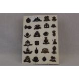 A Collection Of Approx 24 British Military Regimental Badges To Include The Leicestershire Regiment,