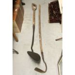 Vintage long handled turf cutting spade and a similar hoe